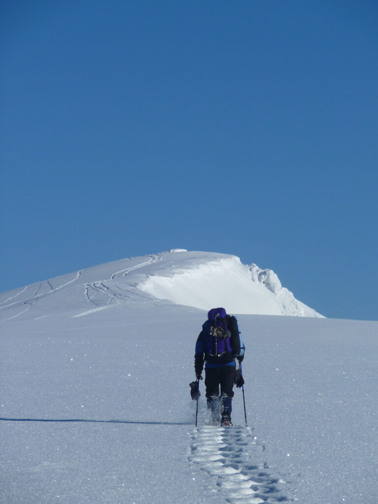 Simon snowshoeing towards Sgor Gaoith