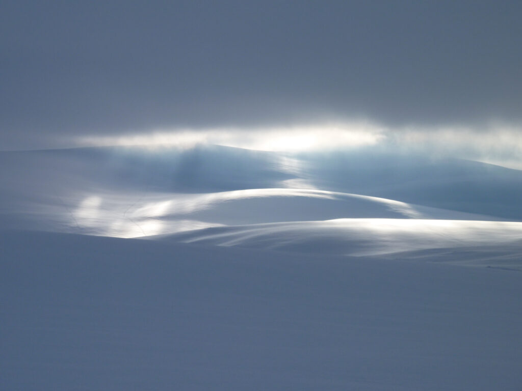Sunlight breaking through on Monadh Mor